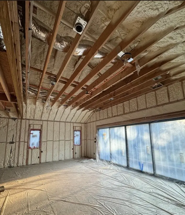 Interior walls and ceiling insulated with spray foam during new construction in Logan